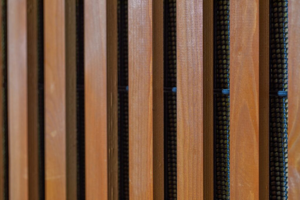 acoustical barrier with a wood cladding finish
