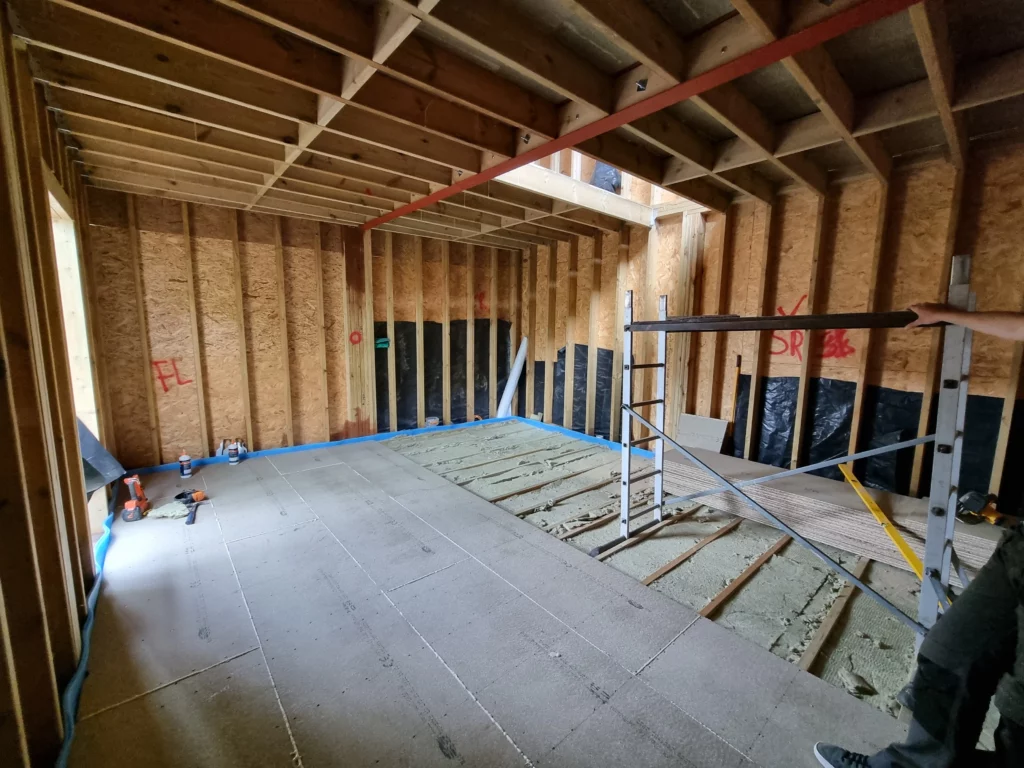 Soundproof home cinema under construction with exposed joists