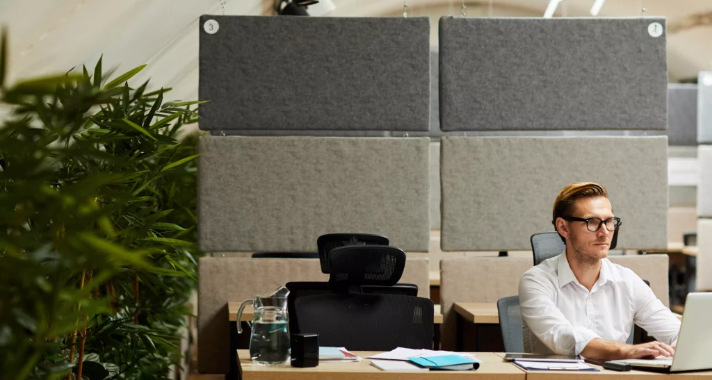 Manchester soundproofing man in office with acoustic panels