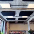 Black acoustic panels on ceiling