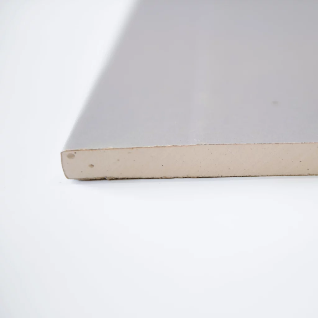close up of acoustic plasterboard showing the bare material
