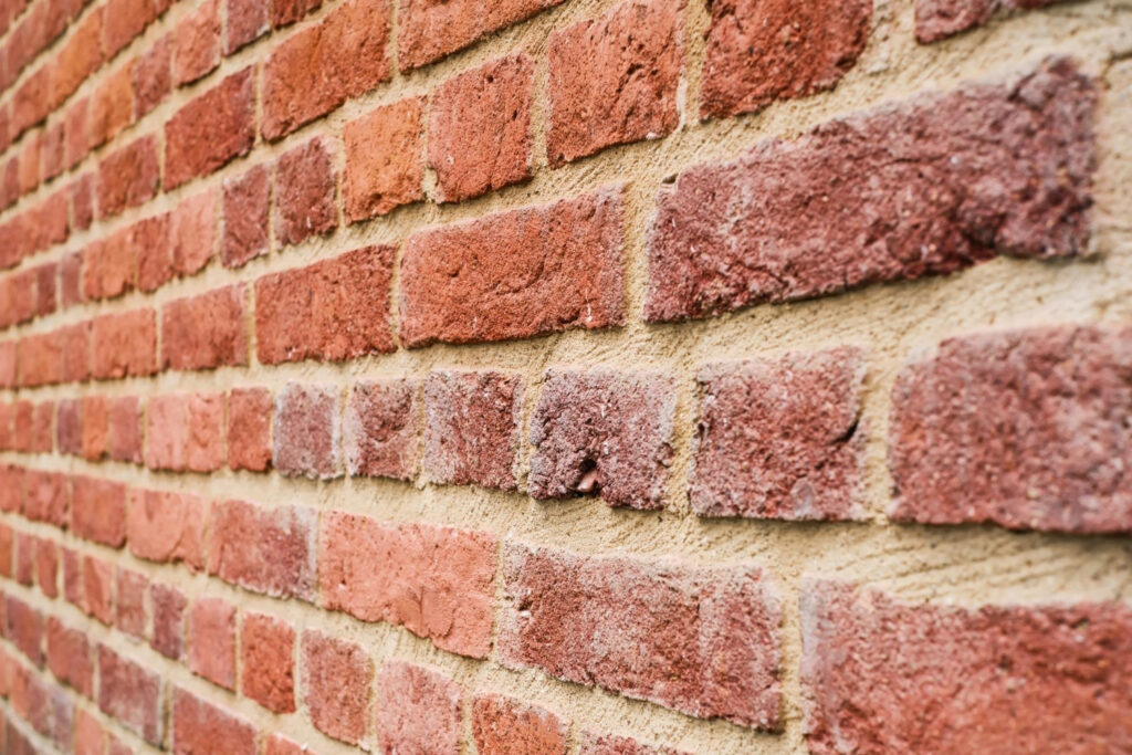 close up view of a red brick wall