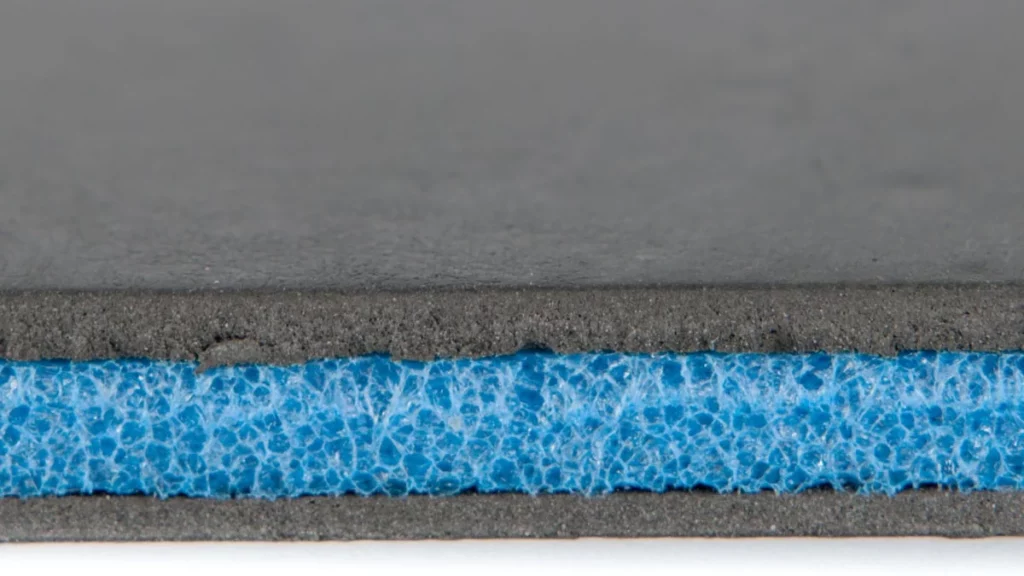 a close up photo of closed cell foam soundproofign underlay for impact noise through floors. 