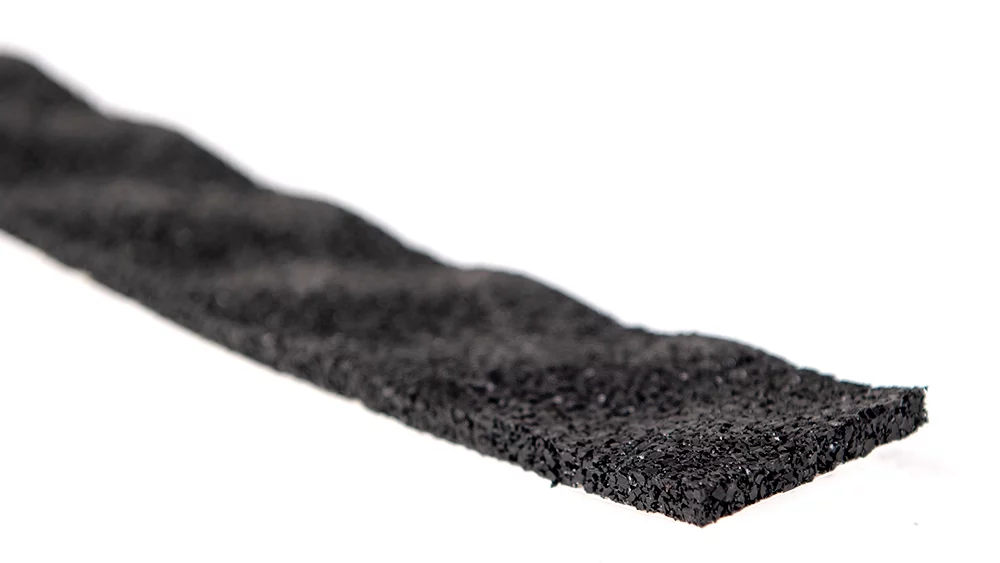 rubber crumb soundproofing isolation strip with a pimpled top texture. Close up to show rubber crumb