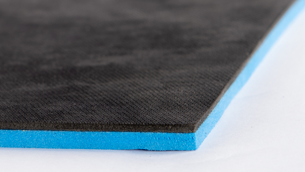 acoustic matting made of two materials; closed cell foam for impact noise and mass loaded vinyl for airborne noise.